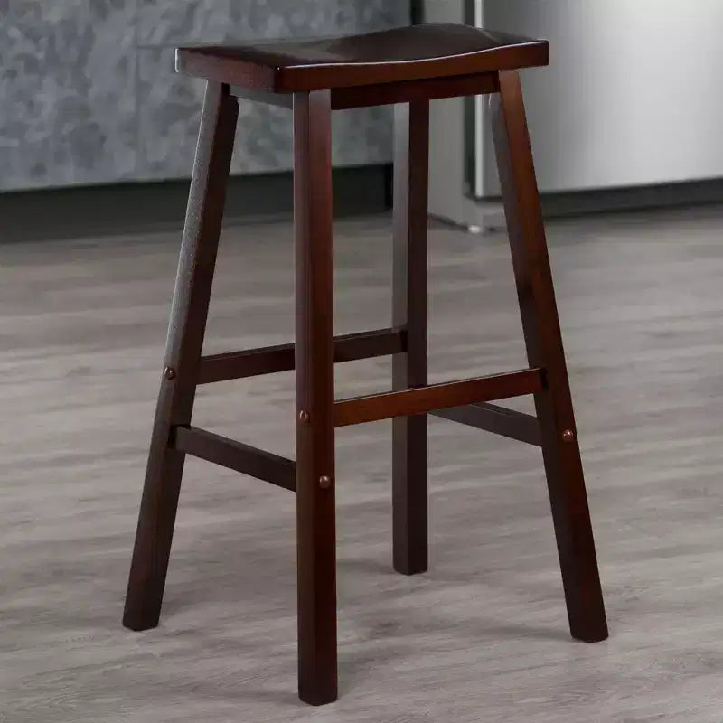 Sgabello da bar con sedile a sella da 29" - Finitura noce anticato, senza schienale, struttura in legno